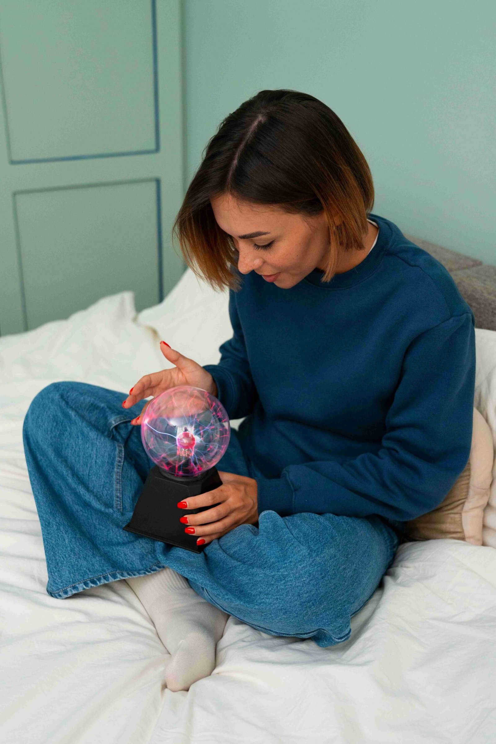 full shot woman interacting with plasma ball 1 11zon scaled
